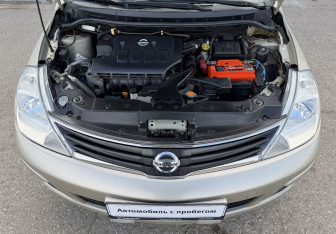 Подержанный автомобиль Nissan Tiida Sedan 2012 года (13 фото)