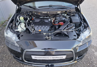 Подержанный автомобиль Mitsubishi Lancer Sedan 2012 года (14 фото)